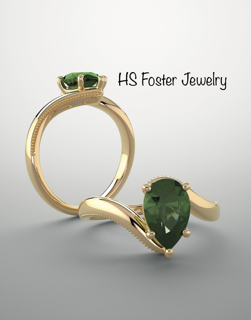 14kt yellow gold lab grown emerald ring.