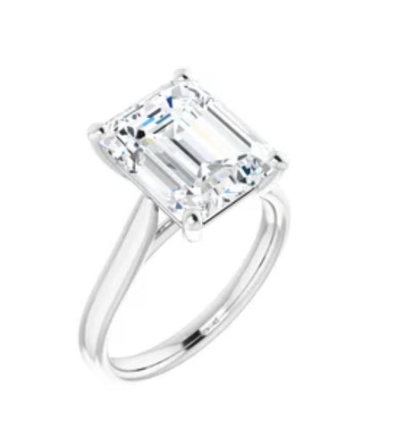 14kt White gold 11 x 9 mm emerald cut moissanite.