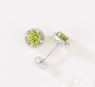 Earrings Set in white gold with peridot and diamonds.