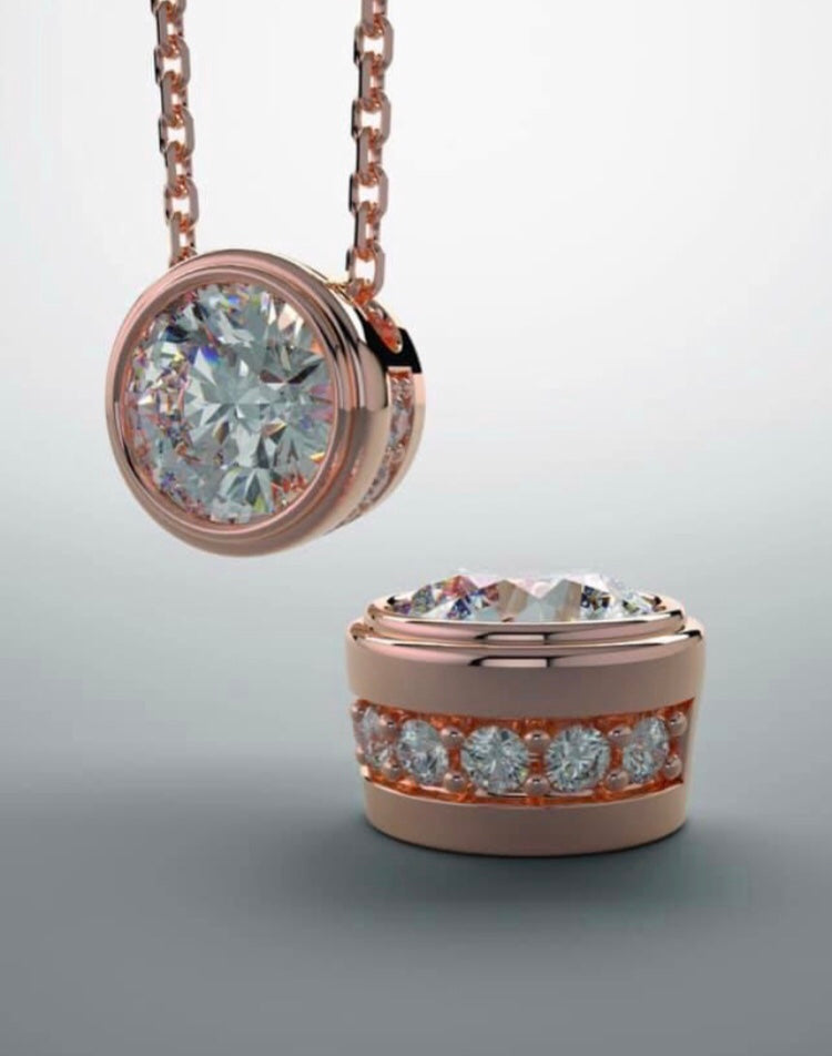 A pendant in rose gold and lab grown diamond.