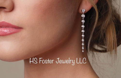 White gold bezel set Lab grown diamonds dangle earrings.