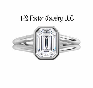 Yellow gold ring featuring a natural emerald cut diamond.