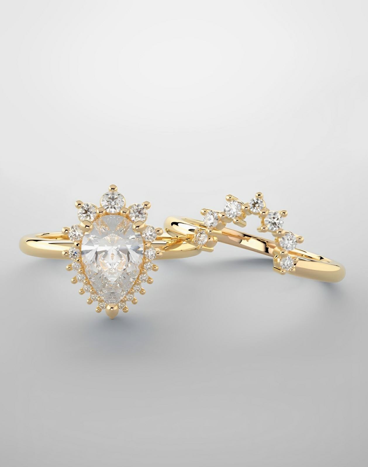 Bridal set, yellow gold and natural diamonds featuring pear-shaped diamond