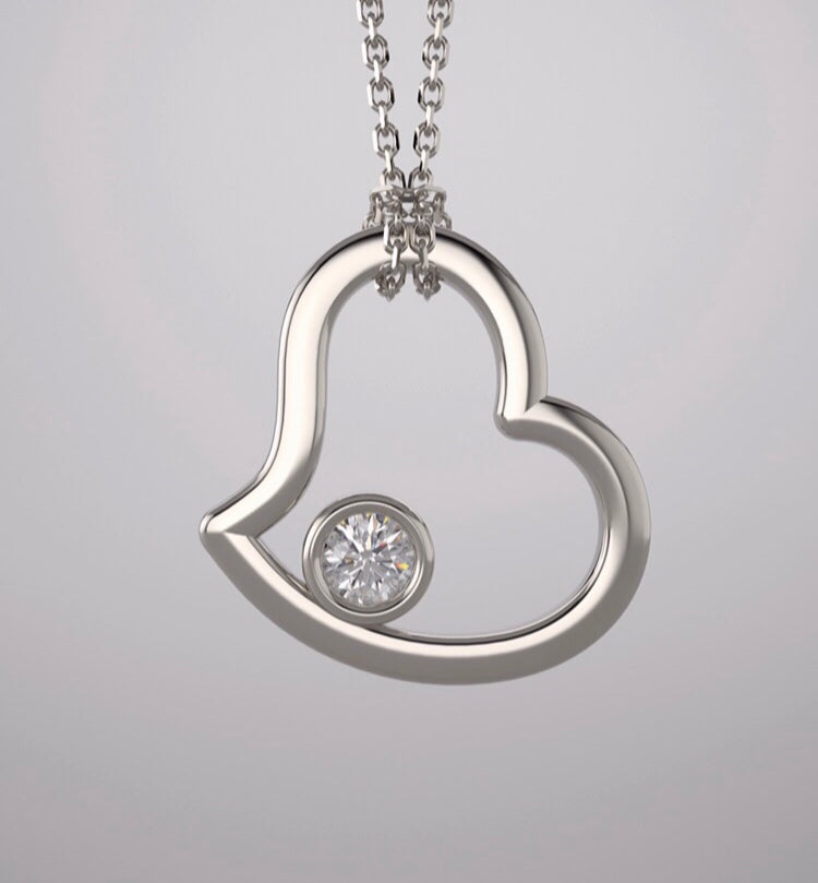 A pendant, continuum silver heart & lab grown diamond