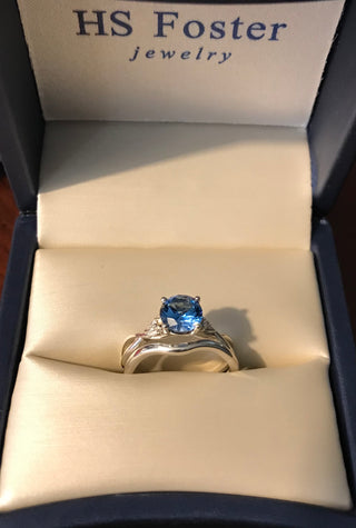 Continuum silver bridal set featuring a London blue Topaz 6.5 mm feature gem.