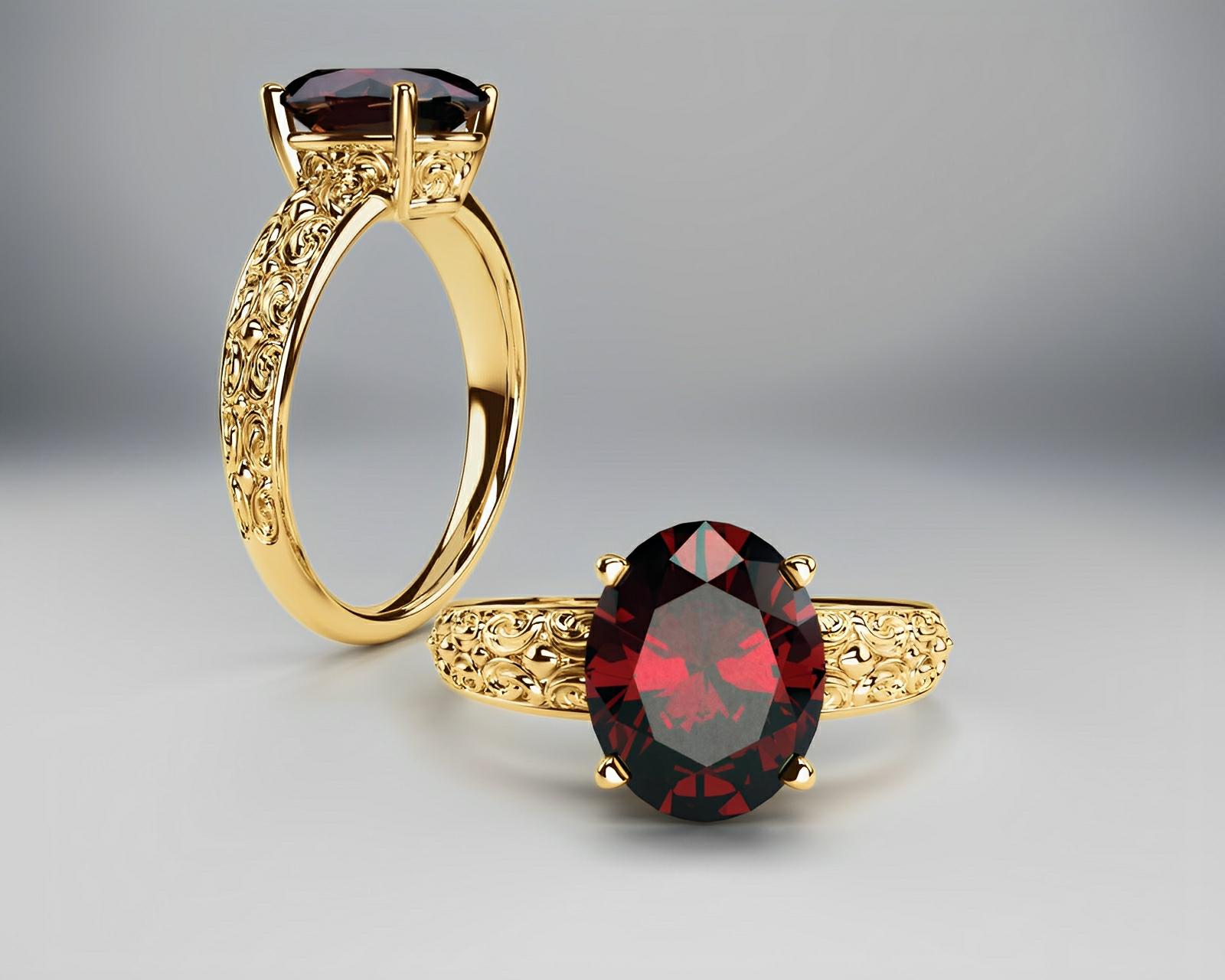 Yellow gold & red garnet ring