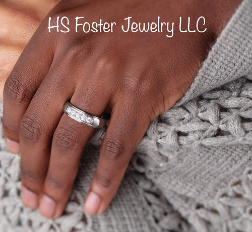 14kt White gold band featuring five natural diamonds.